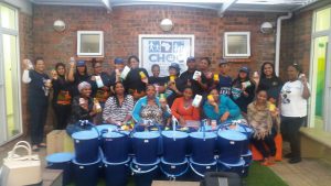 Educor staff together with the mothers who recieved the hampers